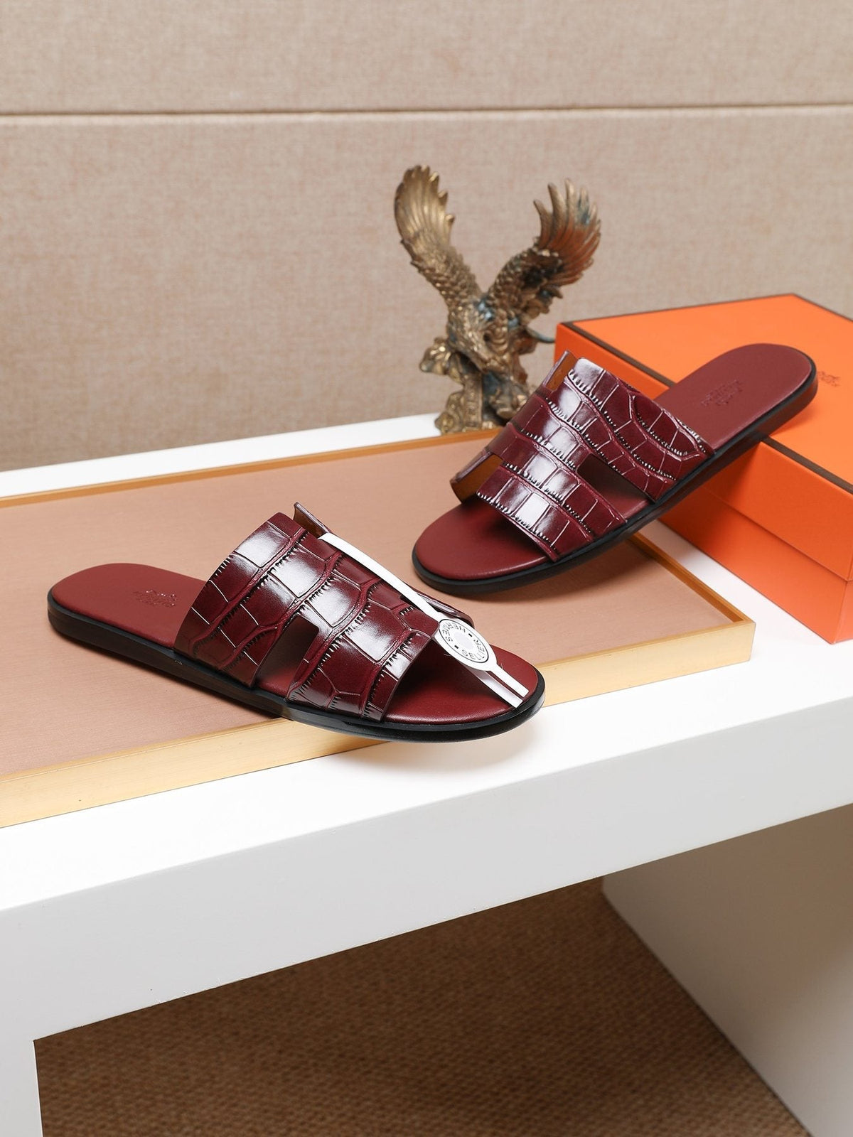 Hermès Burgundy Textured H Slide Sandals — front