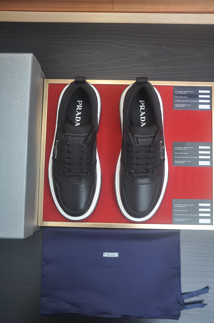Prada Triangle Plaque Low-Top Sneakers — front