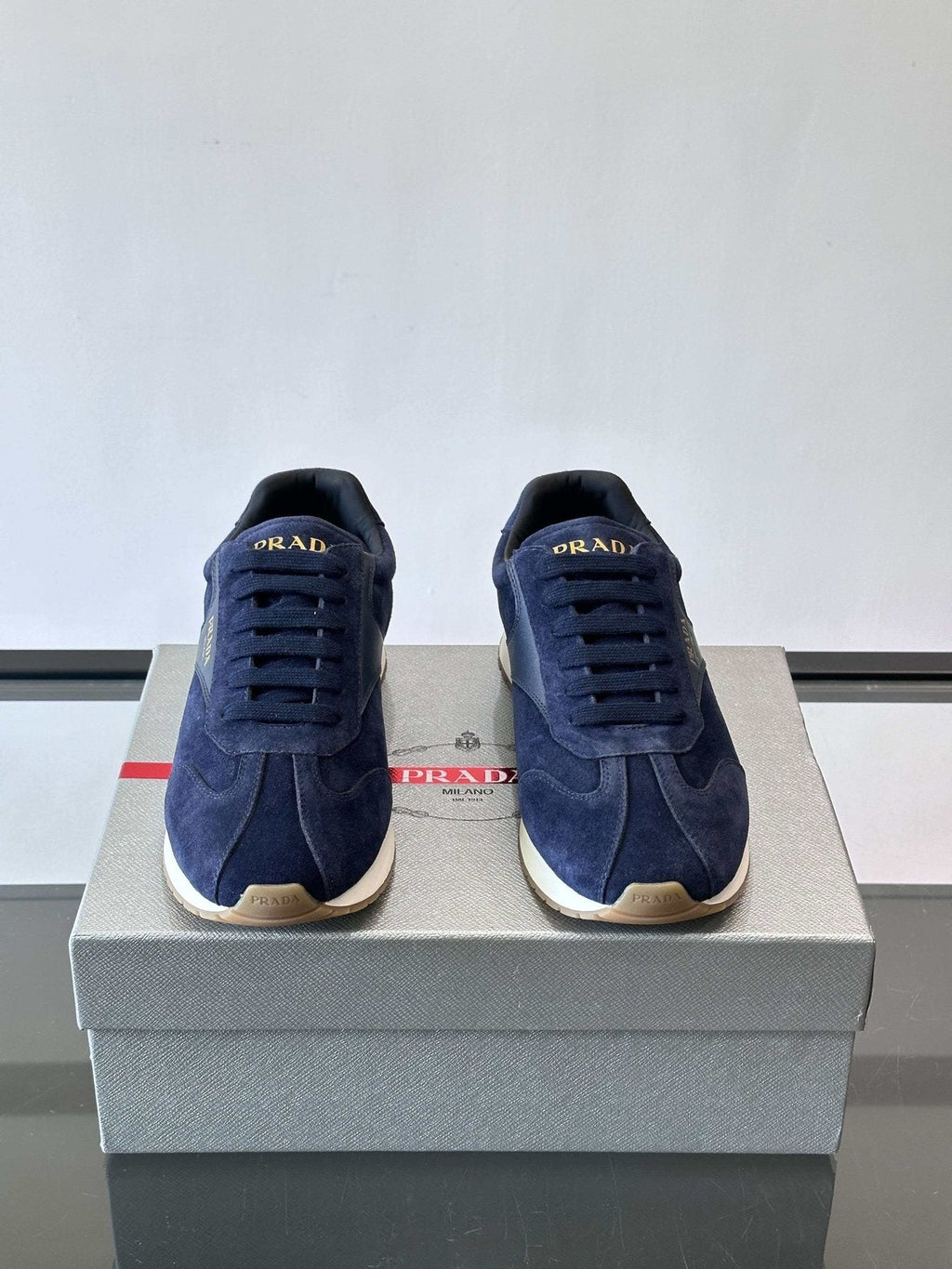 Prada Navy Triangle Badge Sneakers — front